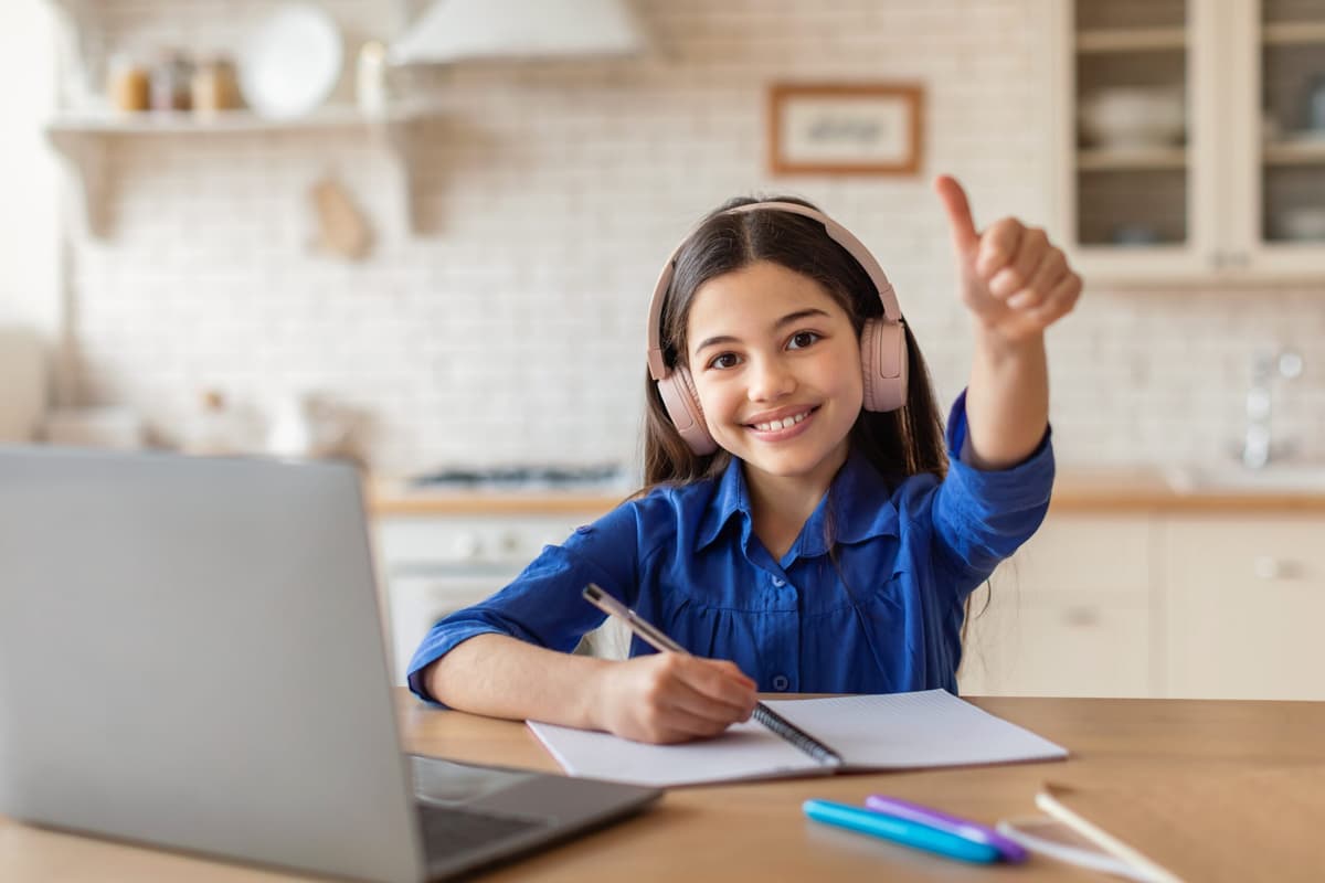 Smiling student studying Quiz vocabulary for ISEE exam preparation